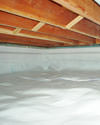 a moisture barrier installed on the walls and floors of a crawl space in Longview