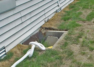 old concrete window well of a Salem crawl space