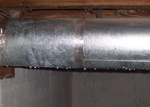 condensation collecting on an HVAC vent in a humid Oregon City basement
