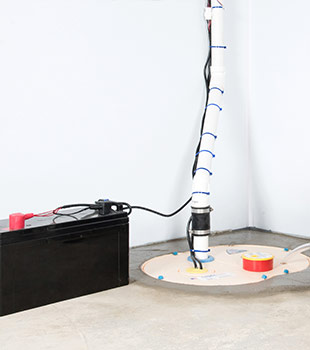 A sump pump installed in Oregon City by John's Waterproofing