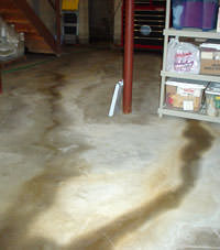 Flooding entering a basement through a floor crack in Battle Ground