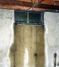 Flooding through basement windows in a The Dalles home.