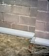 Our baseboard drain system installed on a corner in a Gresham basement.