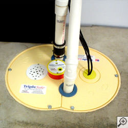 A sump pump system installed along a basement floor in Ionia.