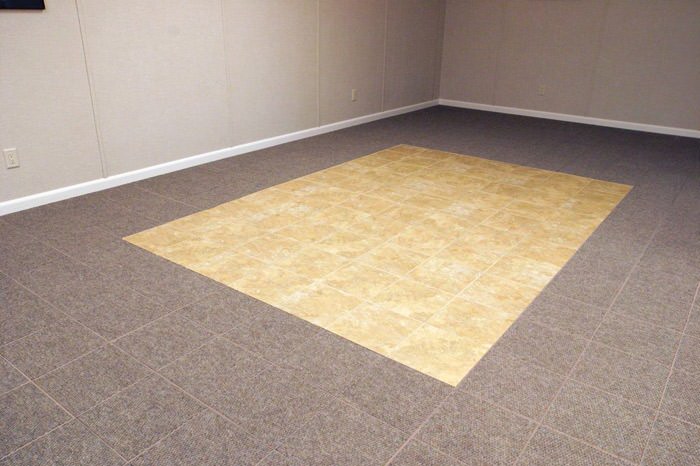 tiled and carpeted basement flooring installed in a Eugene home