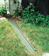 A recessed gutter drain extension installed in The Dalles, Oregon