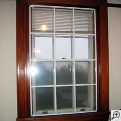Advanced Energy window panels installed on a basement window system in Longview.