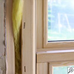 A wood framed basement window installed brand-new in Springfield.